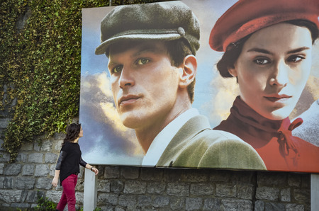 Istanbul, Turkey - October 20, 2013: Turkish film "The Butterfly's Dream" movie posters and street people showing interest. The Butterfly's Dream, poetic life subjects, written and directed by Yilmaz Erdogan made the 2013 drama.のeditorial素材