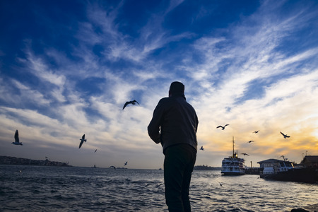 Istanbul, Turkey- February 2, 2014:  Sea of Marmara, the Bosphorus in the evening. sunset, seagulls and peopleのeditorial素材