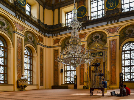 Istanbul, Turkey - February 19, 2013: Bezm-i Alem Valide Sultan / Dolmabahce Mosque. Mosque imam preaching in the pulpit, television video team work.のeditorial素材