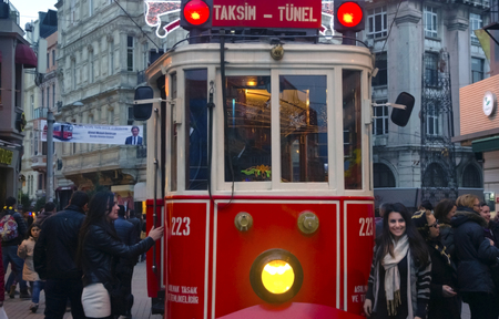 Istanbul, Turkey - December 29, 2013: A historic tram in front of the Beyoglu station of Tunel (1875) at the southern end of Istiklal Avenue.のeditorial素材