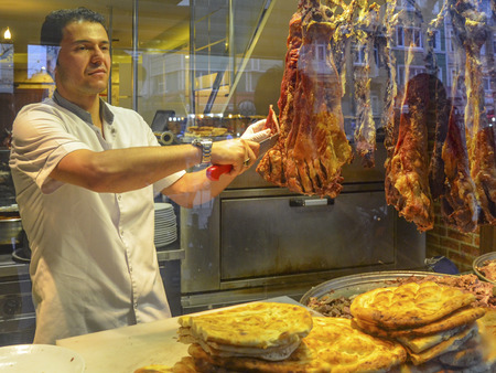 Istanbul, Turkey - January 26, 2014: Istanbul, a famous boulevard with Women Market Buryan kebab in Zeyrek district. Buryan, Puryan or Biryan also called, Turkey's made in many parts of Bitlis, Siirt and a meat dish. Perive also called in Arabic.  Kebab iのeditorial素材
