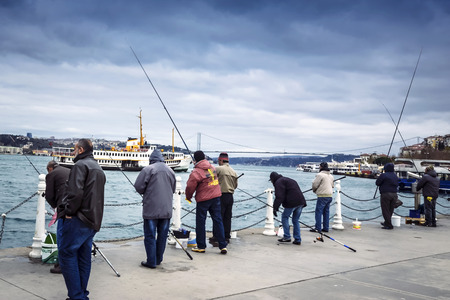 Istanbul, Turkey - December 4, 2013: Istanbul at the Bosphorus bonito, bluefish, mackerel, sardines, sea bass and other bottom fish hunt. Migration time increases in fishing catch fish.のeditorial素材
