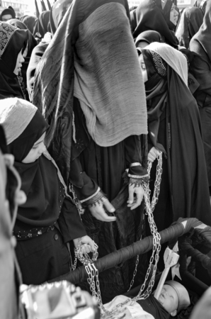 Istanbul, Turkey - November 3, 2014: Universal Ashura Mourning Ceremony. Mourne ashura. Universal Day of Ashura Ceremony, was held in Istanbul to commemorate the martyrdom of Husain ibn Ali, the grandson of the Prophet Muhammad and his 71 friends.のeditorial素材