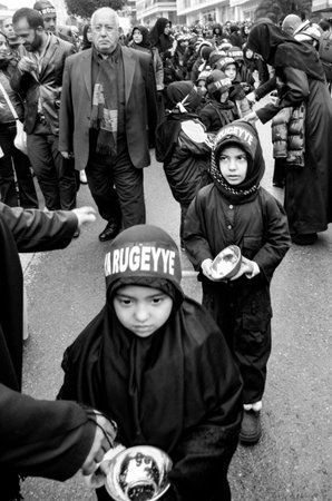 Istanbul, Turkey - November 13, 2013: The global mourning ceremony of Ashura. Karbala Martyrs Commemoration in Arenamega. Thousands of Jaferies in Turkey joined the Karbala mourning ritual where Prophet Muhammad's grandson Imam Hussain and 72 others were のeditorial素材