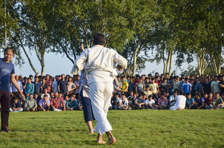 Istanbul, Turkey - July 31, 2016: Central Asian Turkmen wrestling. in Zeytinburnu district of Istanbul, Turkmen wrestling sports events held in the coastal meadows. Turkmen, Uzbek, Afghan, Turkish, Turkmenistan, Kazakhstan, Turkey and other Central Asian のeditorial素材