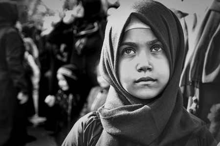 Istanbul, Turkey - October 11, 2016: Worldwide day of Ashura and Children. Turkish Shia Muslims mourning for Imam Hussain. Caferis take part in a mourning procession marking the day of Ashura in Istanbul's Kucukcekmece district, Turkey on October 11, 2016のeditorial素材