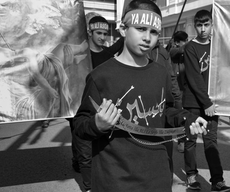 Istanbul, Turkey - October 11, 2016: Turkish Shia children takes part in an Ashura parade in Istanbul's district of Kucukcekmece. Turkish Shia Muslims mourning for Imam Hussain. Caferis take part in a mourning procession marking the day of Ashura in Istanのeditorial素材