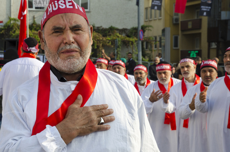 Istanbul, Turkey - October 11, 2016: Turkish Shia men take part in commemorations marking the mourning period of Ashura. The participants in the memorial services wear the names of martyrs on bands around their foreheads. Turkish Shia Muslims mourning forのeditorial素材