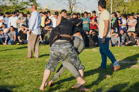 Istanbul, Turkey - October 2, 2016: The Central Asian Turkmen meadow wrestling held in Istanbul. Zeytinburnu district of Istanbul in the meadow, Turkmen, Uzbek, Afghan, Tatar, Kyrgyz and other Central Asian Turkmen done wrestling. Wrestling following turkのeditorial素材