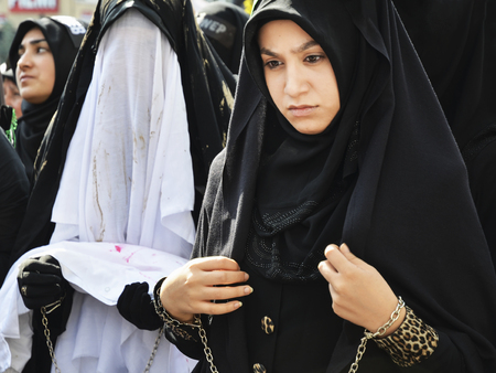 Istanbul, Turkey - October 11, 2016: Shia Muslim women mourn during an Ashura. Turkish Shia Muslims mourning for Imam Hussain. Caferis take part in a mourning procession marking the day of Ashura in Istanbul's Kucukcekmece district, Turkey on October 11, のeditorial素材