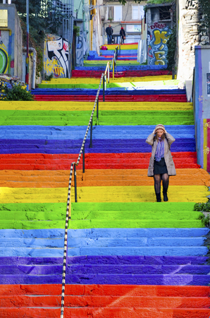 Istanbul, Turkey - February 02, 2014: A Turkish woman is walking in the rainbow-colored stairs on February 02, 2014 in Istanbul. Rainbow-colored stairs in Istanbul. Stairs in the Cihangir and Findikli neighborhoods, which attracts attention after being paのeditorial素材