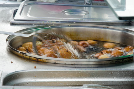 Istanbul, Turkey - Eminonu traditional ottoman bite sweet sellers, made in boiling oil. There is no denying that desserts are a massive part of Turkish culture. When walking around Istanbul, you can see a sweet seller just on almost every corner with moutの写真素材