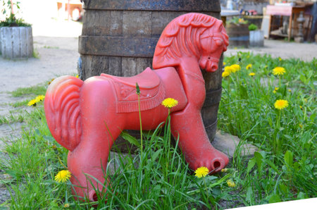 Plastic horse on the grassの写真素材