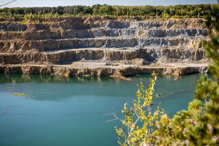 flooded quarry with blue water