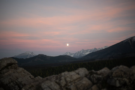 The sunset atop Mount Kopieniec in Zakopane, Poland, casts a warm glow over the Tatra Mountains, creating a stunning landscape that captivates nature lovers with its vibrant colors and breathtaking views.の写真素材