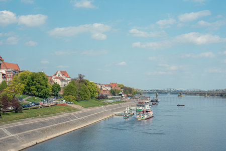 Scenic view of the city of ToruÅ, Poland, from a bridge, showcasing the city's historic architecture and riverside beautyの写真素材