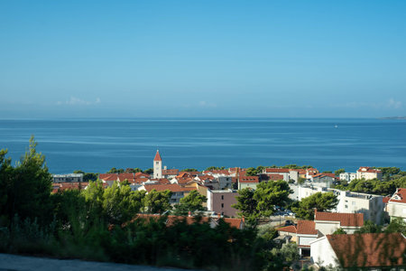 Panoramic view of the coastal town of Brela, Croatia, with azure waters of the Adriatic Sea in the...