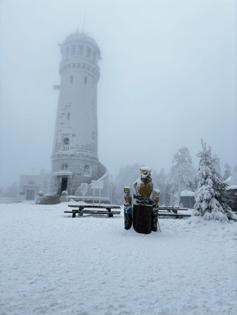 Observation tower on snow-covered Mount Wielka Sowa, Poland, winter scene