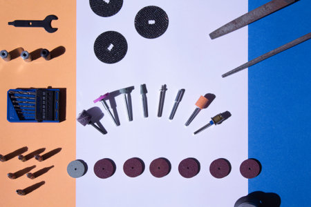 Copy space of overhead photography of multifunction tool on white background with flexible shaft,...