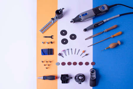 Copy space of overhead photography of multifunction tool on white background with flexible shaft, black handle and others accessoriesの写真素材