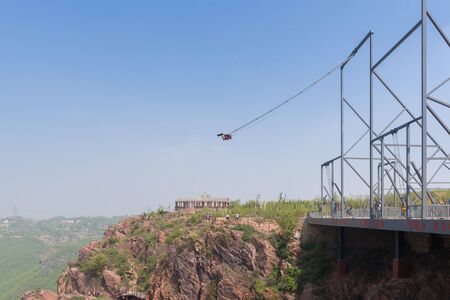 Cliff swing at fuxi mountainの写真素材
