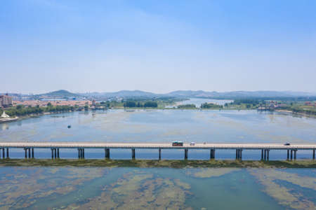 Bridge over the scenic river in Yishui city, Shandongの写真素材