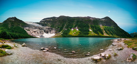 Scenic View of BÃ¸yumsbreen glacier, part of Jostedalsbreen glacier, feeding into lake, Vestland, Norway.の写真素材
