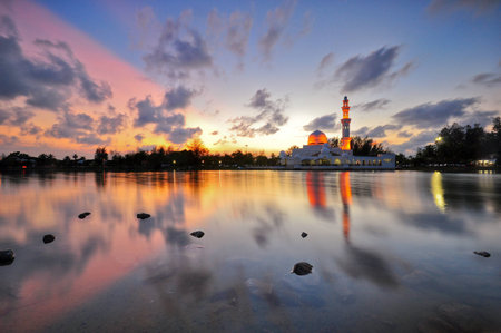 Long exposure shot of twilight over the lake and floating mosque.の写真素材