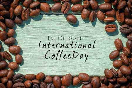 International Coffee Day text and roasted coffee beans on the wooden background.の写真素材