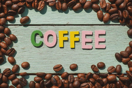 International Coffee Day text and coffee beans on the wooden background.