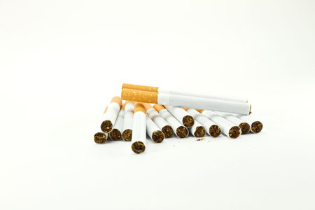a bunch of cigarettes isolated on whiteの写真素材
