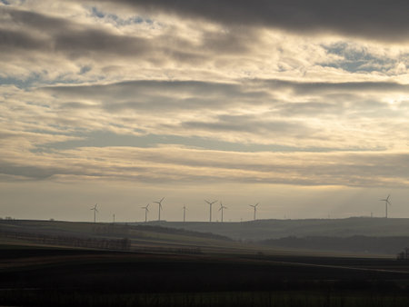 These are windmills at sunset.
