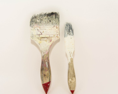 Used paint brush isolated in white の写真素材