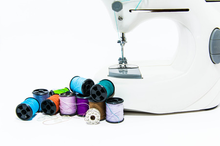 many color of threads and white buttons isolate white backgroundの写真素材