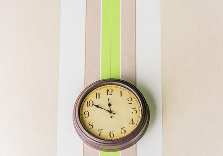 clock hanging on the beautiful wallの写真素材