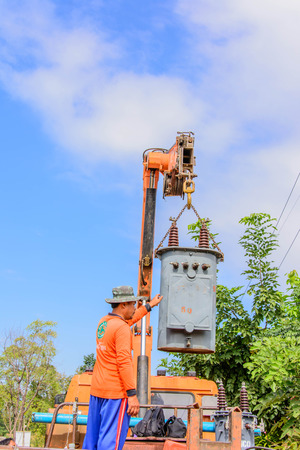 Old transformer with insulators and wires on a background azure skyのeditorial素材