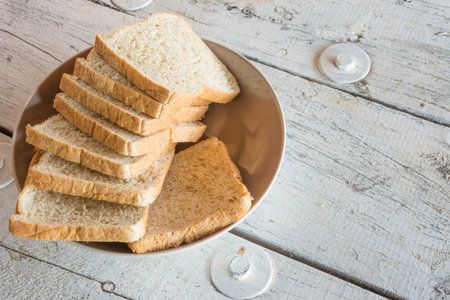 whole wheat bread on dish on wooden table