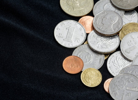 many coins on black background