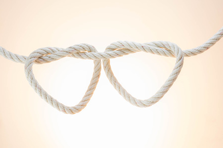 leash  rope into heart shape on white backgroundの写真素材