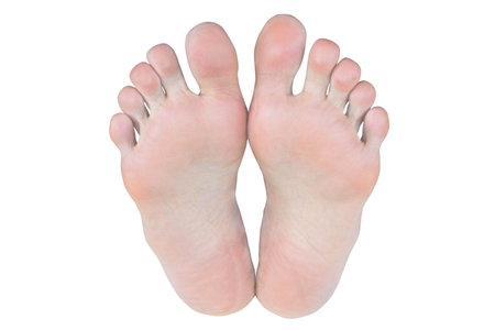 Blurry photo of bare feet isolated on white backgroundの写真素材