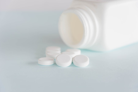 pills medicine and pills bottels on white backgroundの写真素材