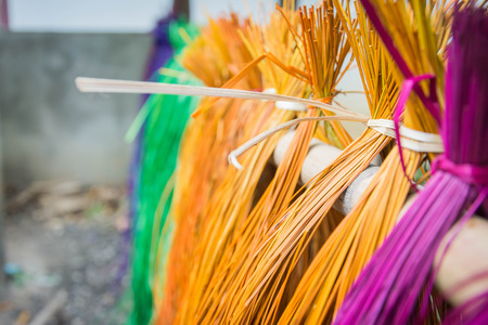 soft focus (depth on field)?many color of dry straw mats hanging on bamboo barの写真素材