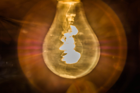 Abstract motion blur of fluorescent light on black backgroundの写真素材