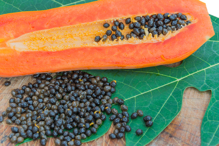 papaya with seeds on leafの写真素材