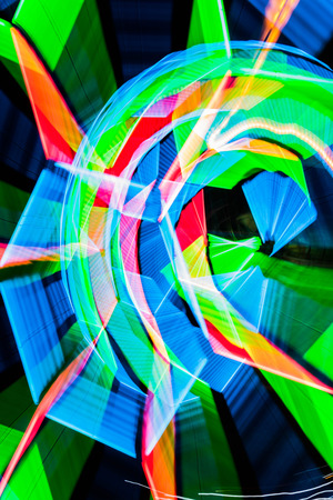 Abstract motion blur of lights on street in festivalの写真素材