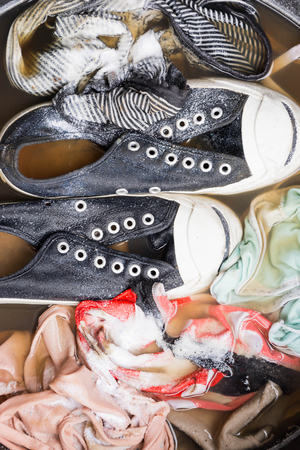 soaked rags and shoe in basinの写真素材