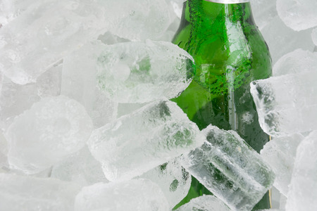 Glass bottle in ice bucketの写真素材