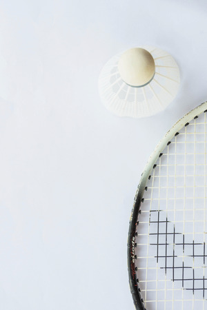 Shuttlecock and racket on white backgroundの写真素材