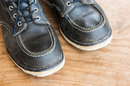 combat boots on wooden floor
