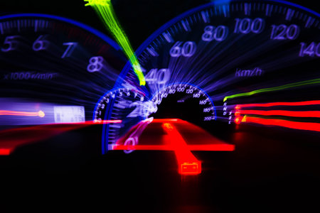 abstract motion blur of light with car's Speedometer illuminated